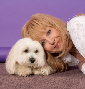 coton de tulear with her mom lying down