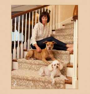 two-dogs-with-owner-on-stairs
